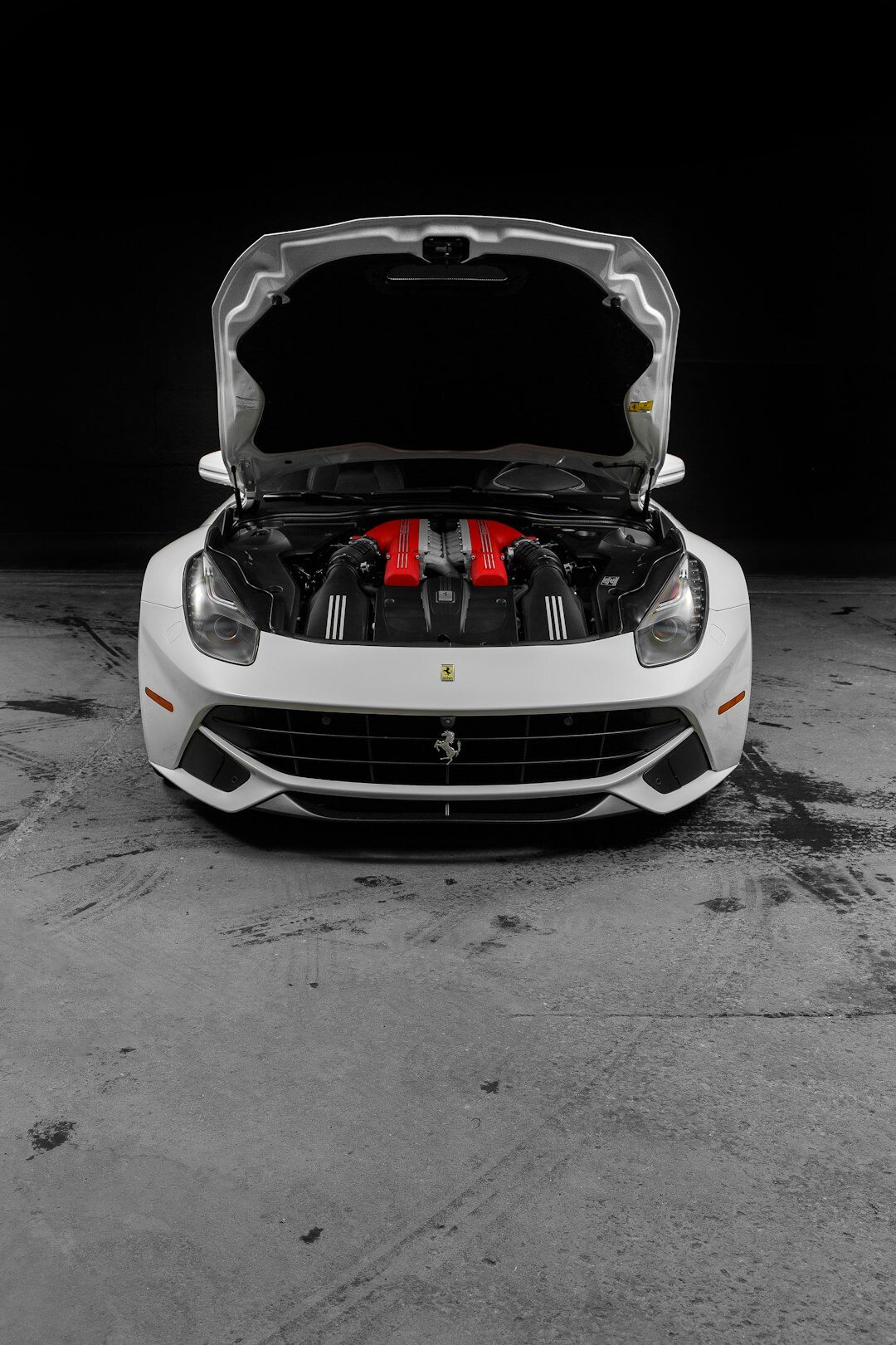 Close-up of a powerful V12 engine bay of a luxury supercar