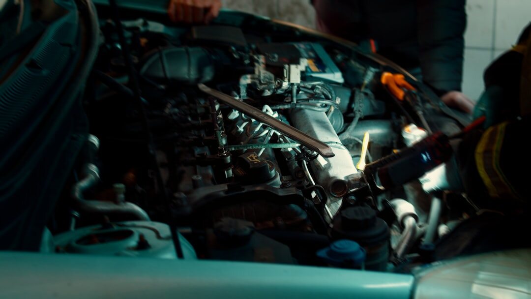 mechanic checking car engine