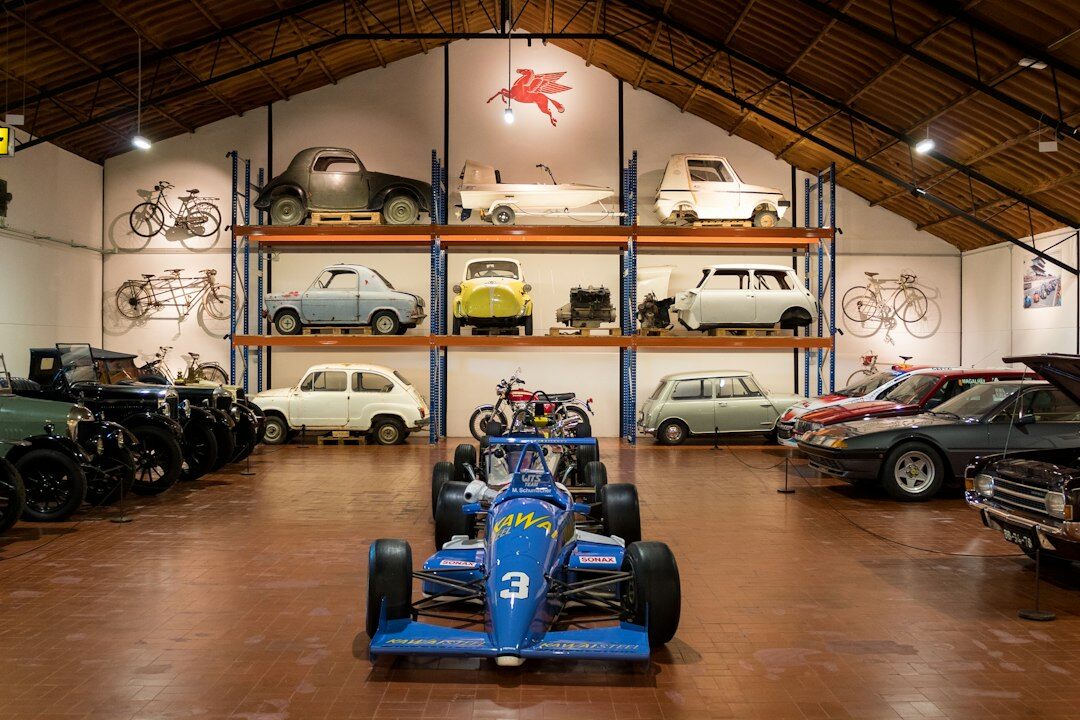 Interior of a classic automobile museum with vintage cars on display