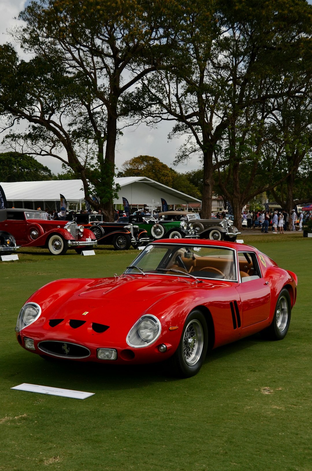 Rare vintage automobile displayed at an auction house event